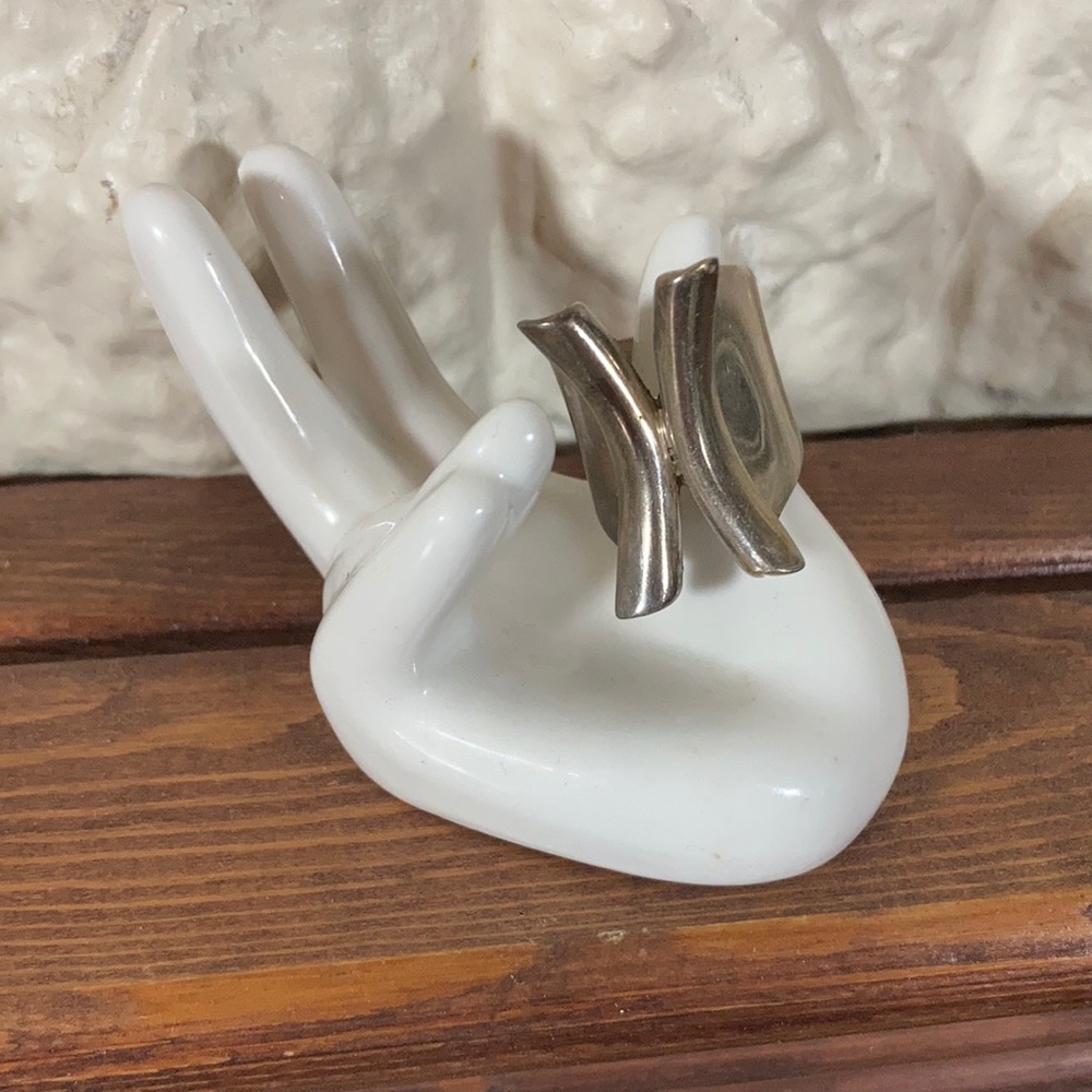 Silver X shaped ring